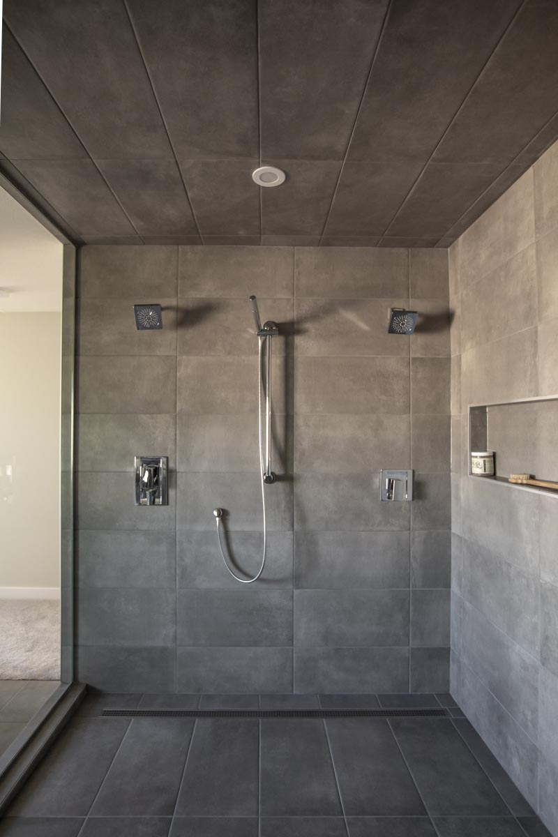 Chrome showerheads are highlighted in the master ensuite wet room